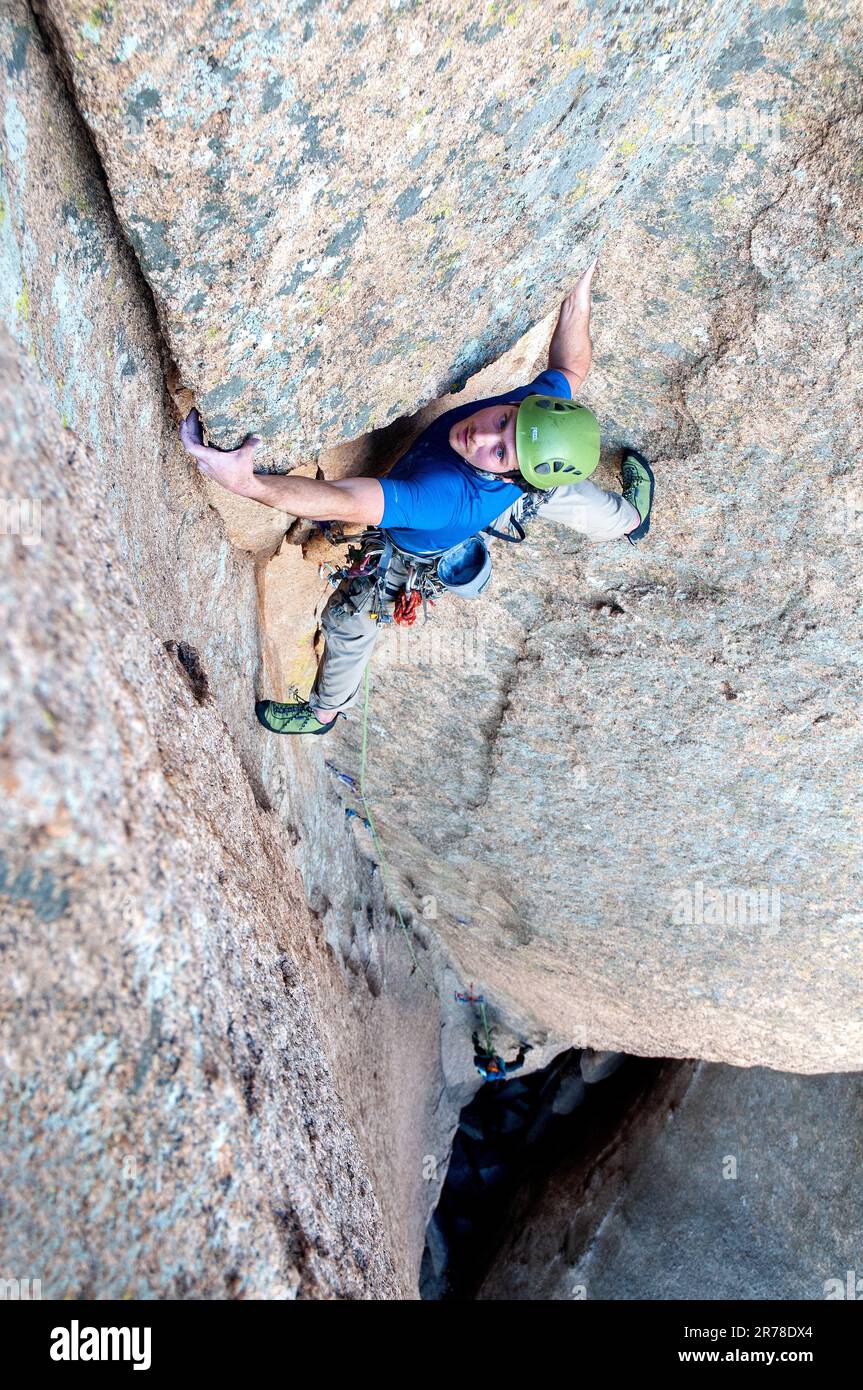 Male rock climber ascending steep rock. Cochise Stronghold, Arizona Stock Photo