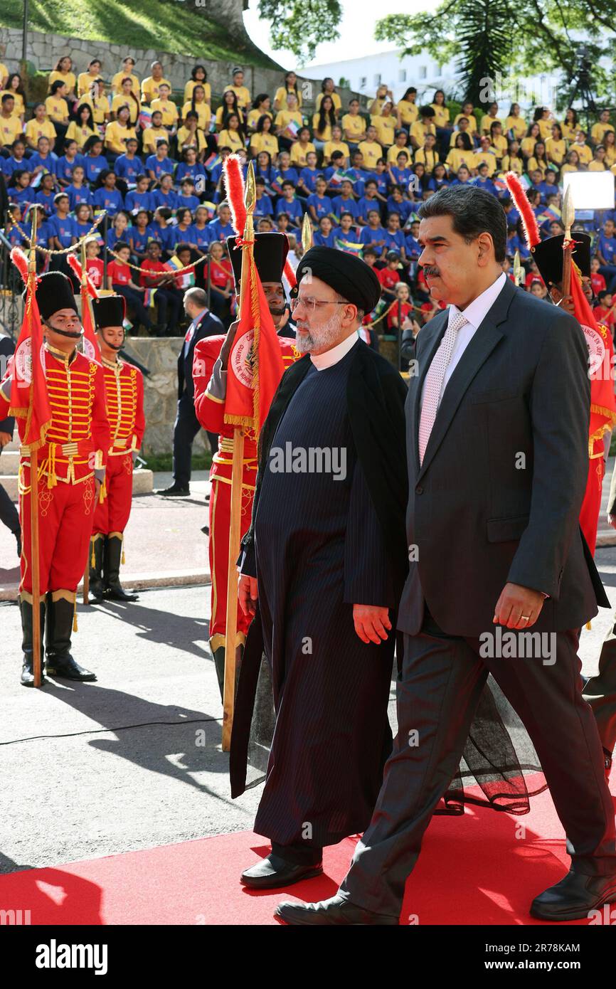 June 12, 2023, Caracas, Tehran, Venezuela: The president of Venezuela, NICOLAS MADURO (R), receives the president of Iran, EBRAHIM RAISI (C), at the presidential palace of Miraflores. Raisi landed this 12 June in Venezuela, at the Simon Bolivar International Airport, in Maiquetia, which serves Caracas, where he was received with honors by a delegation headed by Venezuelan Foreign Minister Yvan Gil. Venezuela is the first stop for the Iranian president on his tour of Latin America, which also includes Cuba and Nicaragua. (Credit Image: © Iranian Presidency via ZUMA Press Wire) EDITORIAL USAGE O Stock Photo