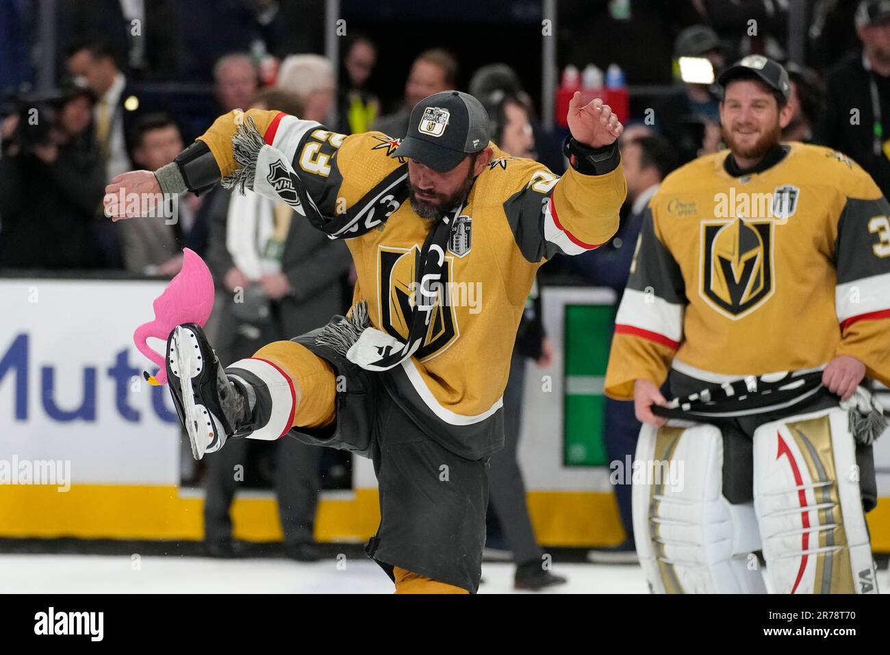 Vegas Golden Knights defenseman Alec Martinez, left, kicks a plastic  flamingo as backup goaltender Jonathan Quick watches after the Knights  defeated the Florida Panthers 9-3 in Game 5 of the NHL hockey