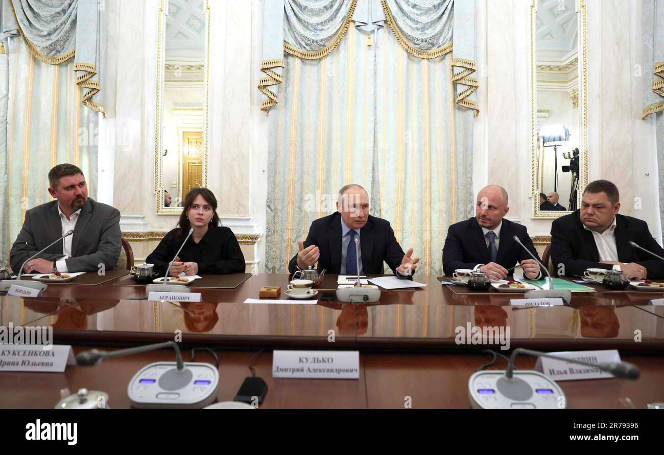 Moscow, Russia. 13th June, 2023. Russian President Vladimir Putin, center, delivers remarks during a face-to-face meeting with Russian war correspondents and pro-Kremlin bloggers at the Grand Kremlin Palace, June 13, 2023 in Moscow, Russia. From left: Yevgeny Poddubny (Russia 24 TV), Yekaterina Agranovich (Katrusya Telegram channel), Vladimir Putin, Andrei Filatov (Russia Today), and Ilya Ushenin (NTV Television Company). Credit: Gavriil Grigorov/Kremlin Pool/Alamy Live News Stock Photo
