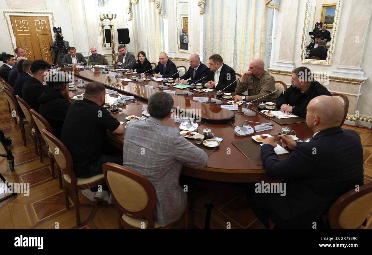 Moscow, Russia. 13th June, 2023. Russian President Vladimir Putin, center right, holds a face-to-face meeting with Russian war correspondents and pro-Kremlin bloggers at the Grand Kremlin Palace, June 13, 2023 in Moscow, Russia. Credit: Gavriil Grigorov/Kremlin Pool/Alamy Live News Stock Photo