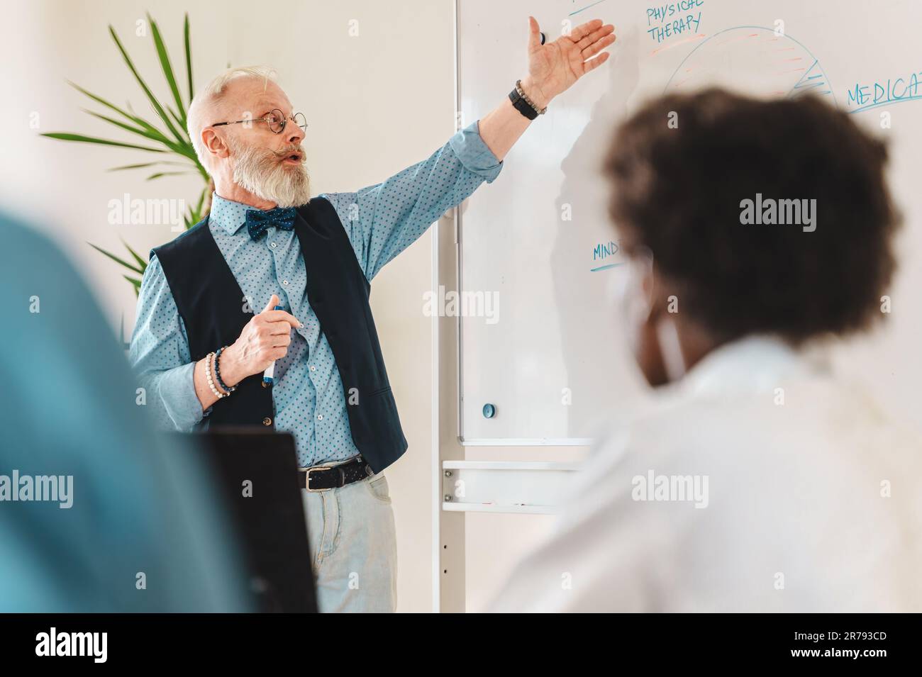 Eccentric professor explaining 'Physical Therapy' to attentive audience