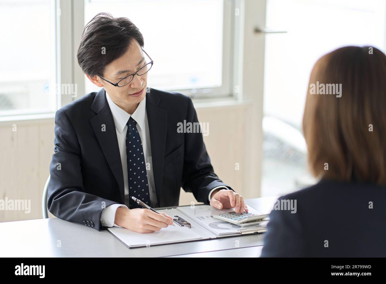 Asian male tax accountant receiving tax consultation Stock Photo Alamy