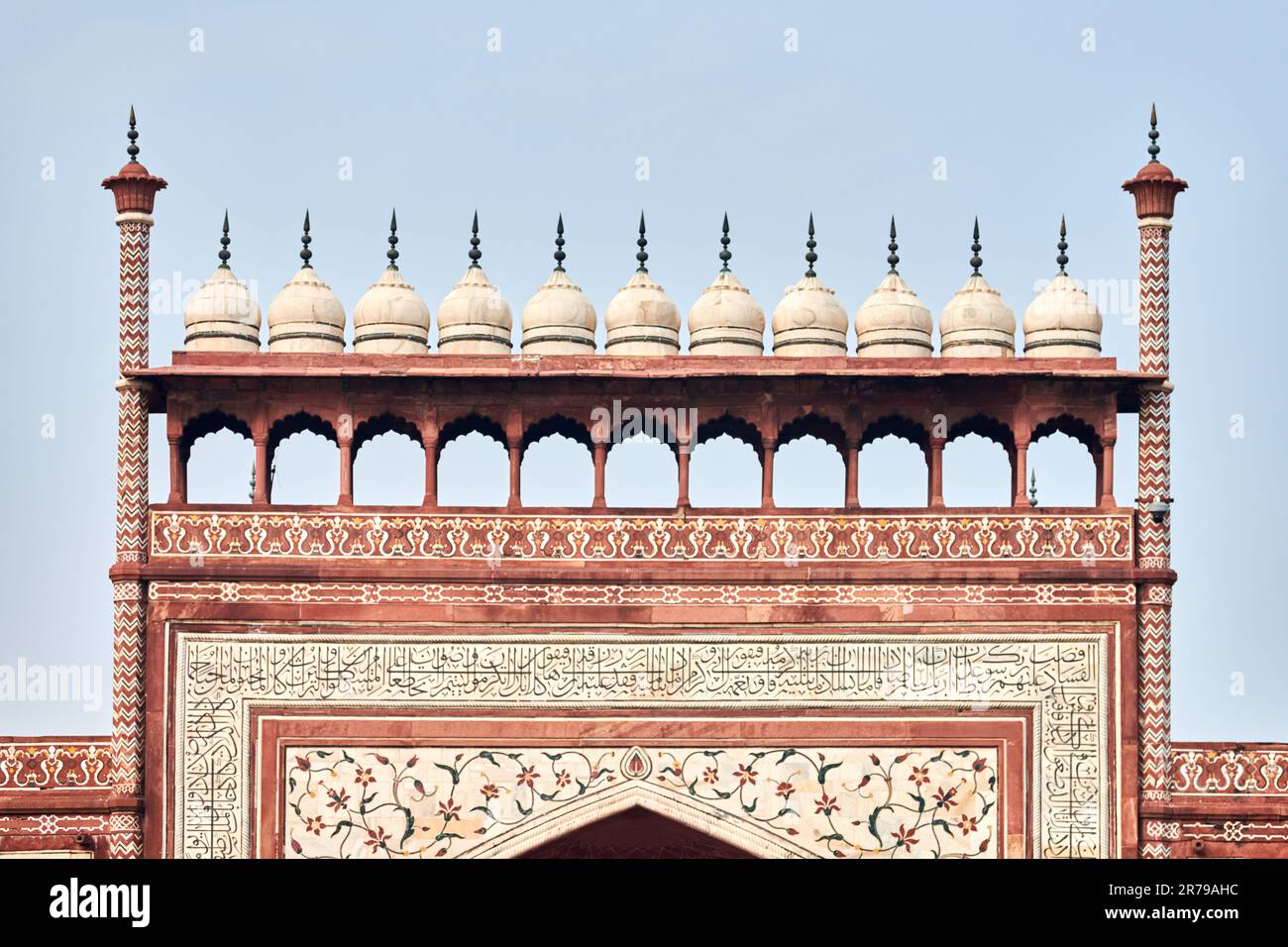 Taj Mahal entrance gateway close up view with Chhatri dome shaped pavilions Indian architecture blue sky background, aerial view of Taj Mahal main gat Stock Photo