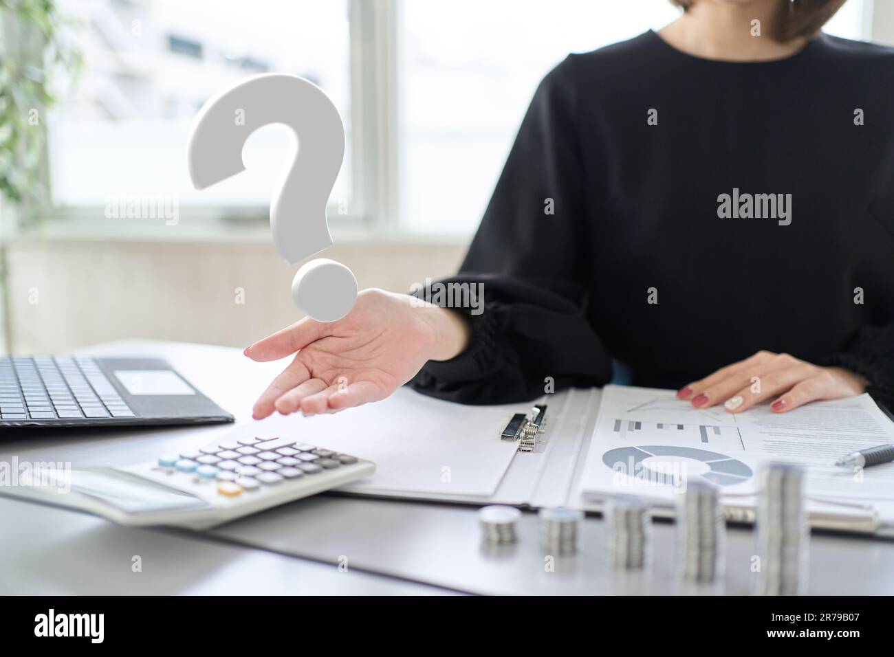 Woman's hand answering investment questions Stock Photo