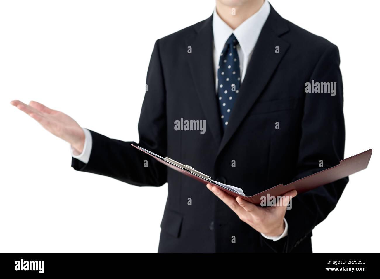 Asian businessman holding a binder and explaining Stock Photo