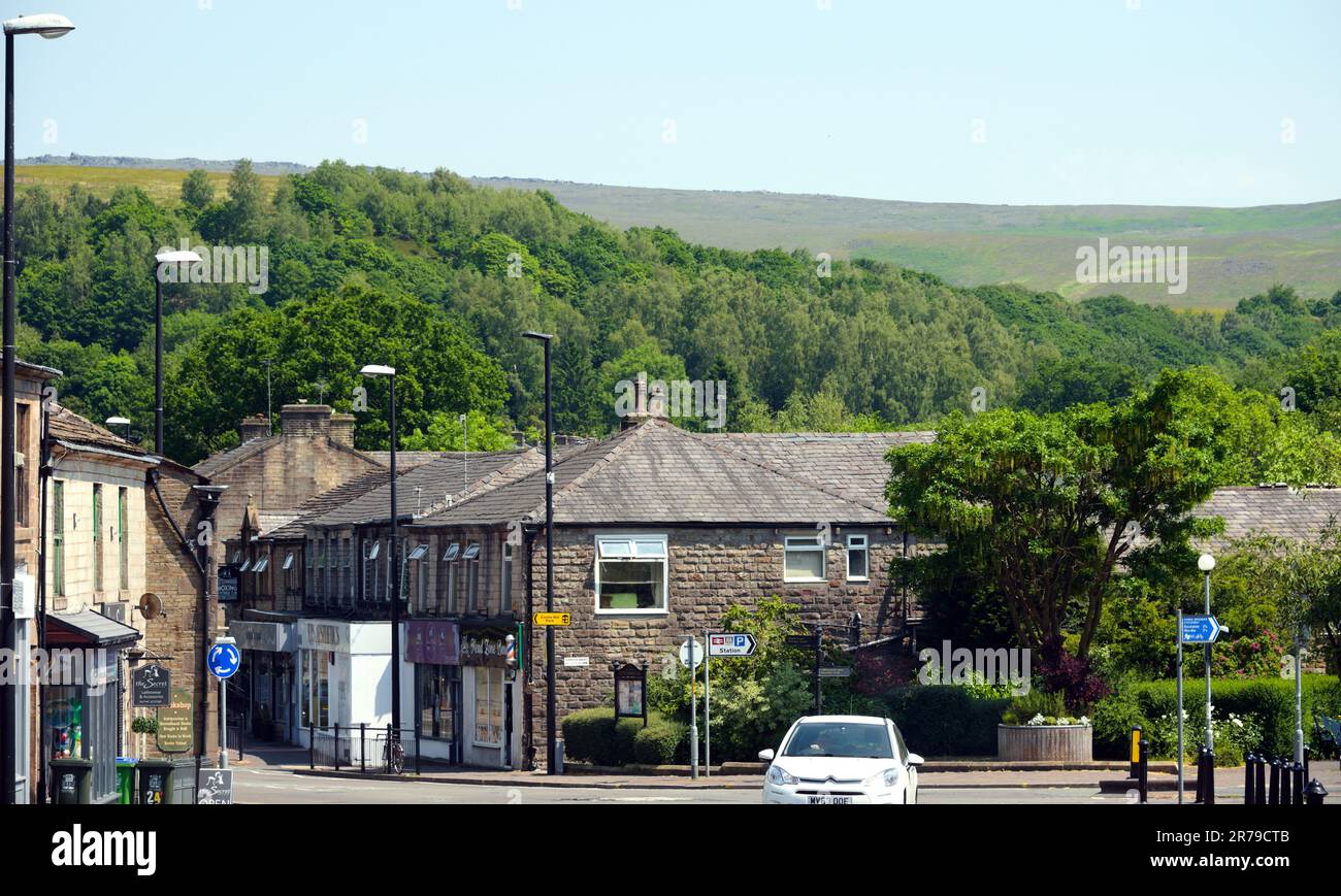 Littleborough, UK, 14th June, 2023. Road junction in centre of Littleborough where Railway Street meets Halifax Road, with pretty hills behind. Broadway Malyan developed a masterplan for Littleborough, Greater Manchester, focusing on new homes, a better public space, and increased economic activities. The plan was approved by Rochdale Council, which aims to attract more people and businesses to the area. The masterplan emphasises improving connectivity between the rail station and the village centre. Credit: Terry Waller/Alamy Live News Stock Photo