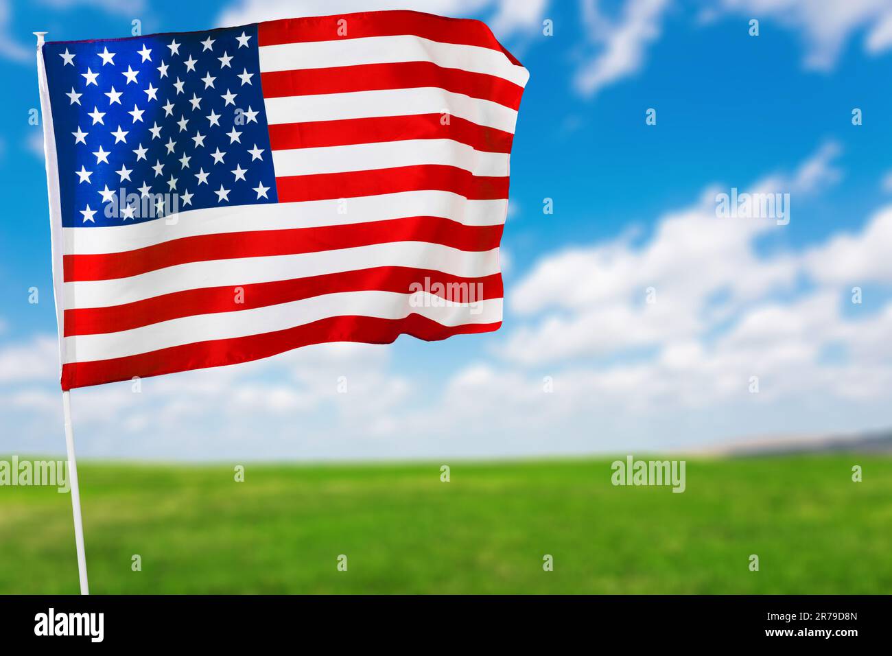 American flag against blue sky Stock Photo - Alamy