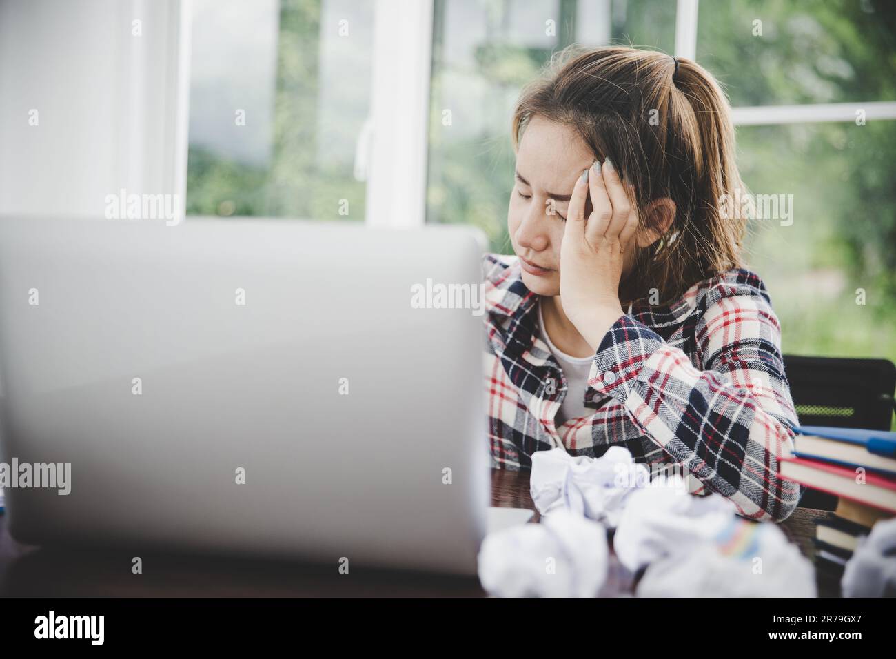 woman sitting down, his face unsettled. At the computer desk she has