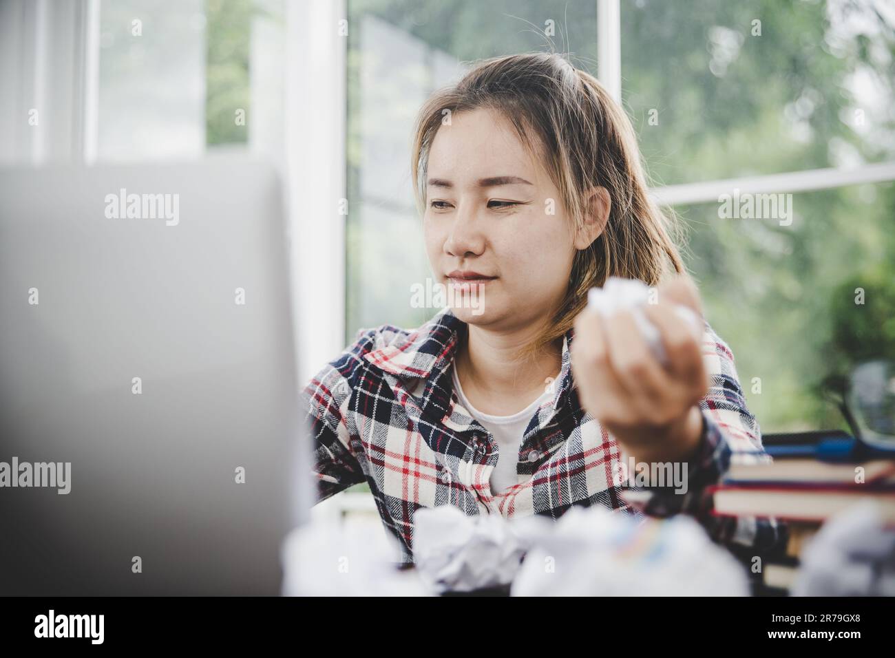 woman sitting down, his face unsettled. At the computer desk she has