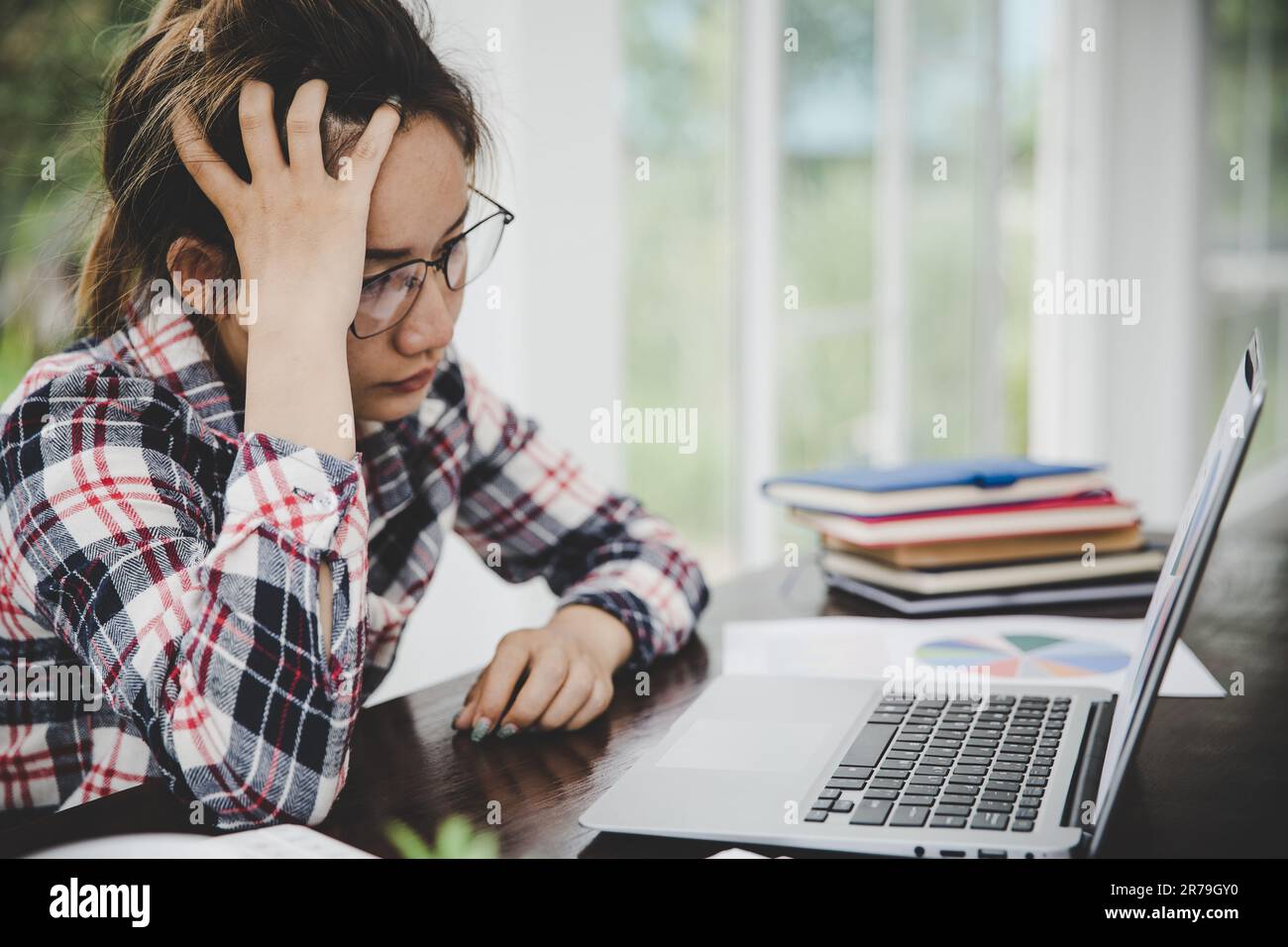 woman sitting down, his face unsettled. At the computer desk she has