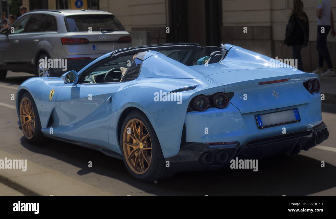 open roof blue Ferrari car in the city traffic.Milan Italy,06 June