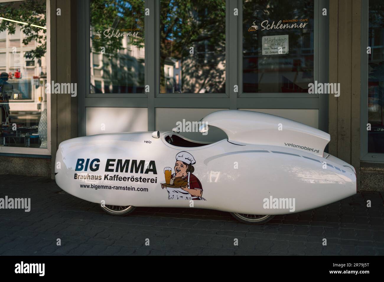 Futuristic looking four wheel (velomobile) vehicle parked in front of a store in Germany Stock Photo