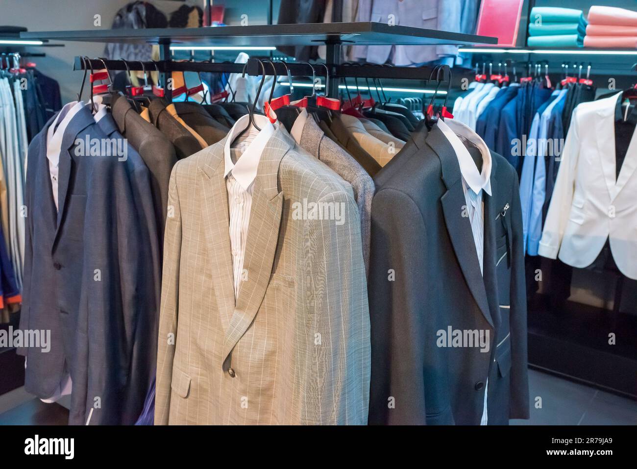 Clothes on hangers in a store. Rack with clothes in a shopping center ...
