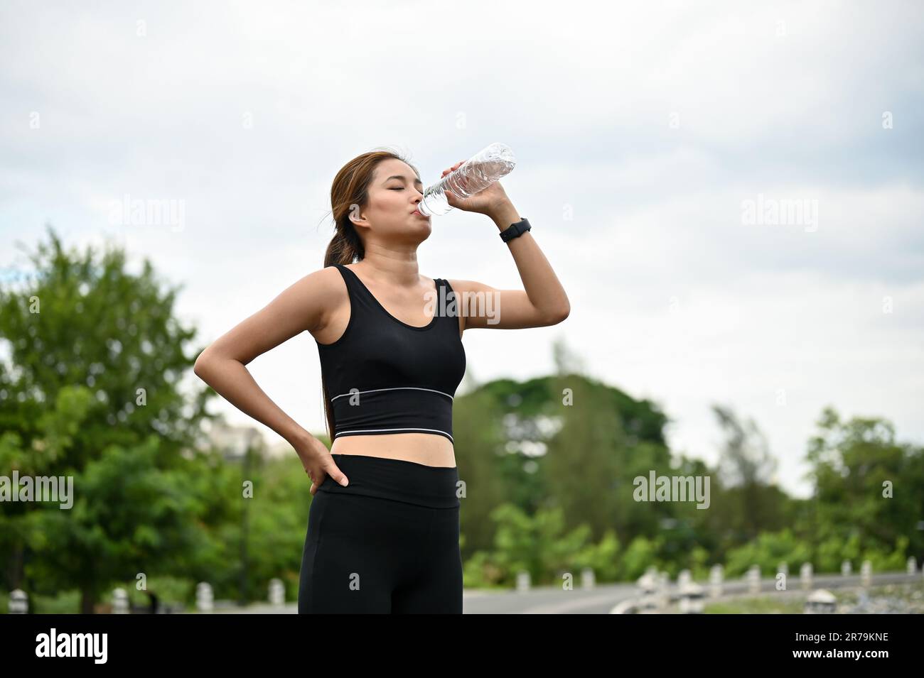 Girl running in the park,(((Drink bottled water))),Jade sweat
