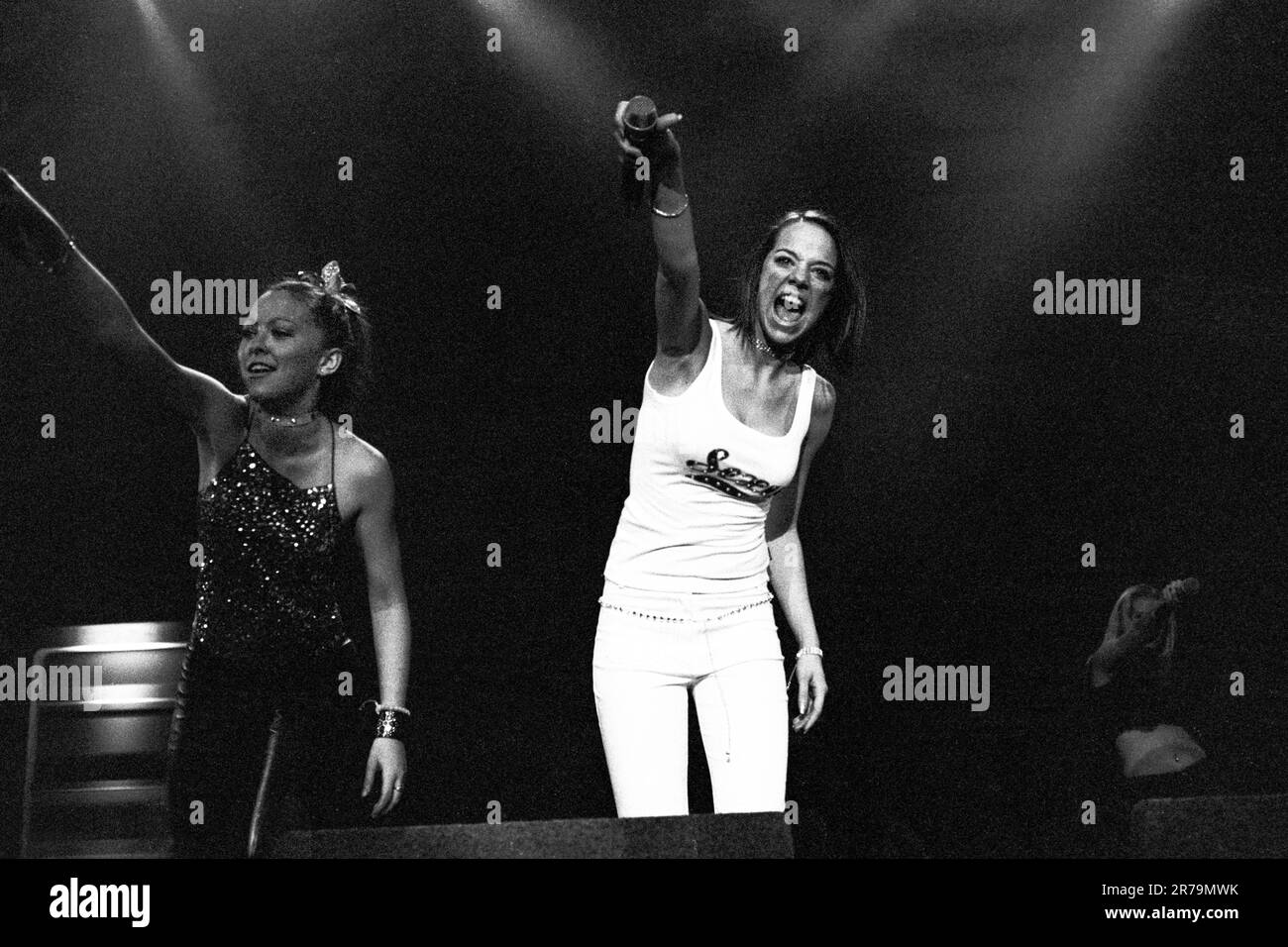 ATOMIC KITTEN, ORIGINAL LINEUP, 2000: Liz McClarnon and Jenny Frost of Atomic Kitten on the Smash Hits 2000 Tour playing live at Cardiff International Arena CIA in Cardiff on 30 November 2000. Photograph: ROB WATKINS.   INFO: Atomic Kitten, a British girl group formed in 1998, achieved major success in the early 2000s with hits like 'Whole Again' and 'The Tide Is High.' Known for their catchy pop tunes and harmonies, they became icons of UK pop music. Stock Photo