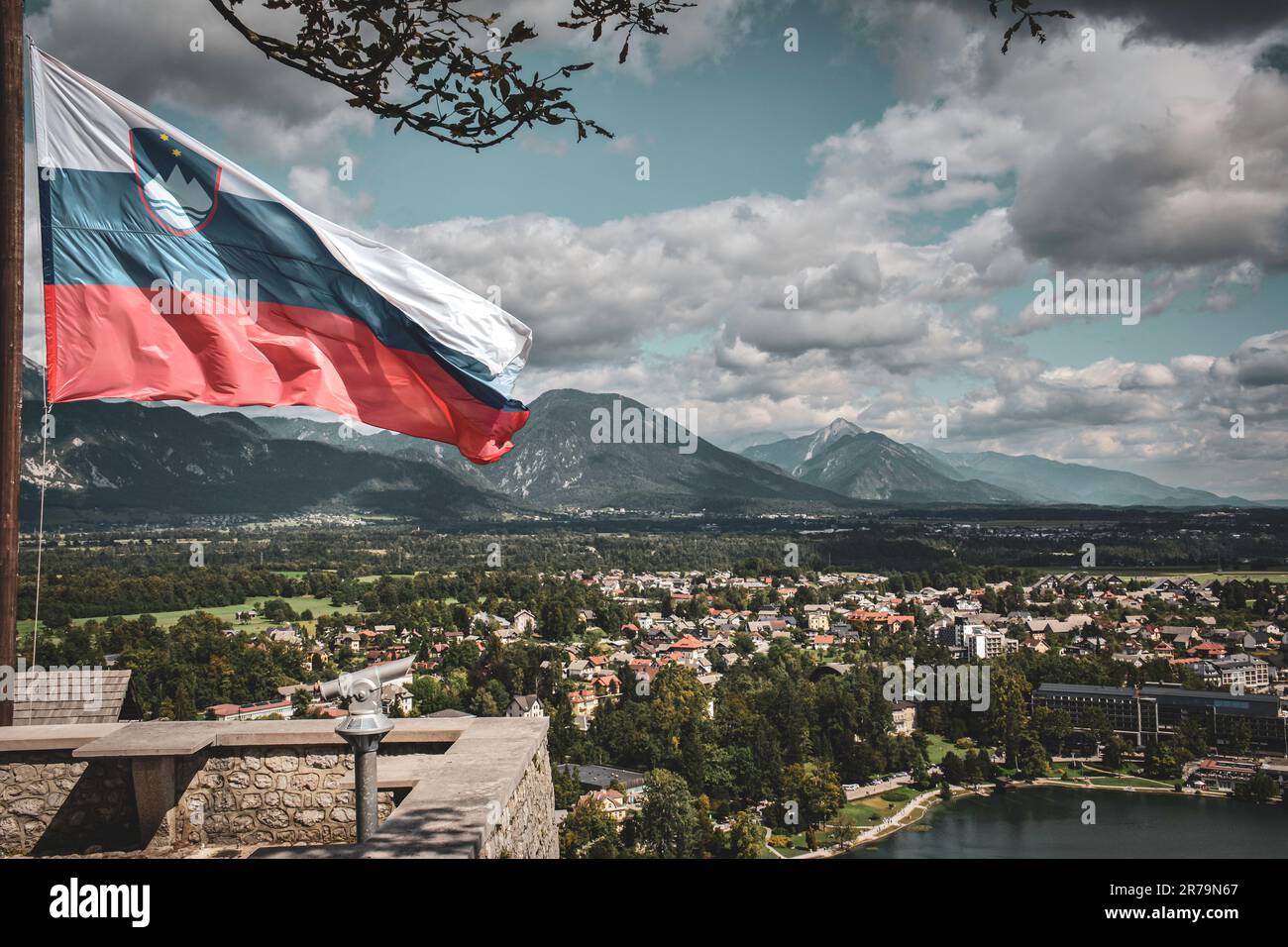 The Slovene National Flag by the Wind in Bled Castle Stock Photo
