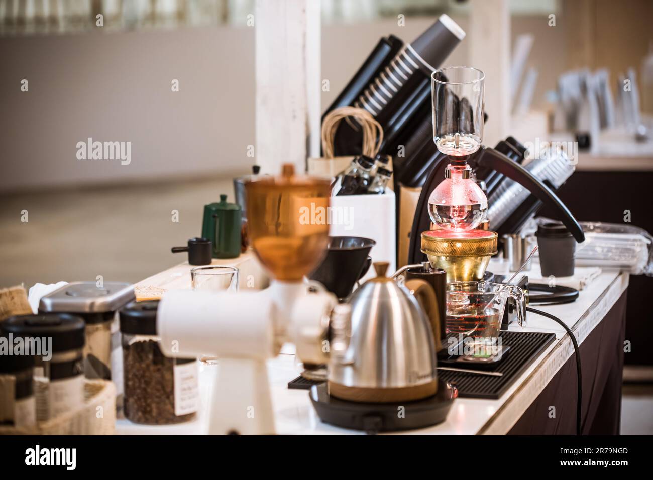 Professional coffee maker Barista using coffee siphon brewing hot