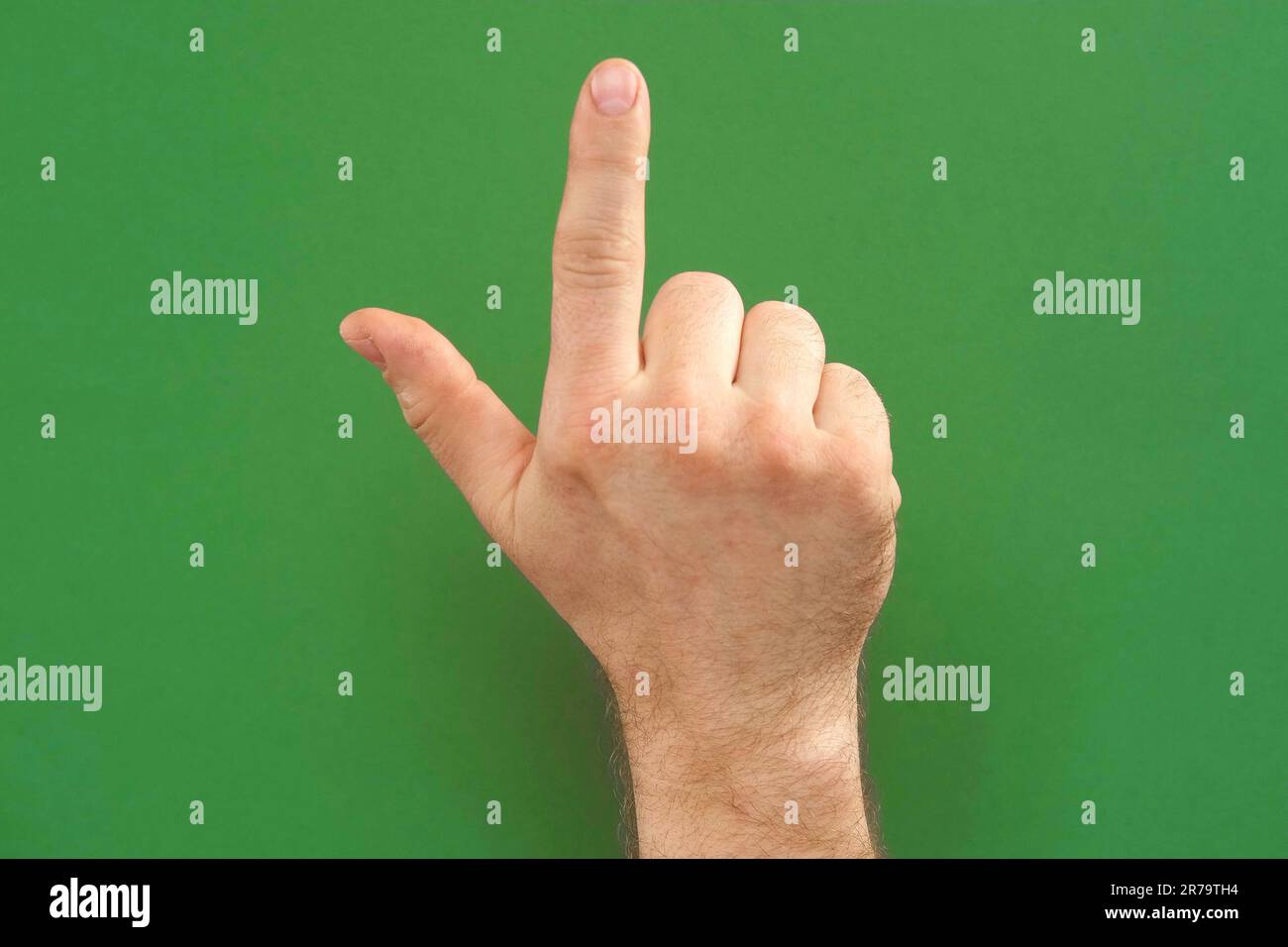 Gestures pack. Male hand touching, clicking, tapping and swiping on chromakey green screen. Zoom in, zoom out. Close up. Using for a smartphone, table Stock Photo