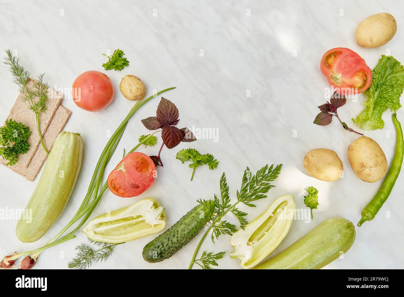Natural organic vegetables and greens flat lay with copy space. Veganism, Plant based diet concept background. Stock Photo