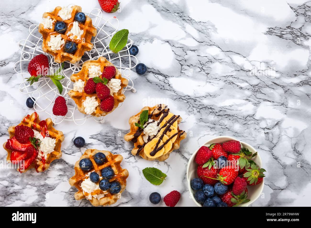 Delicious Belgian Waffles with berry, fruit, whipped cream and ...