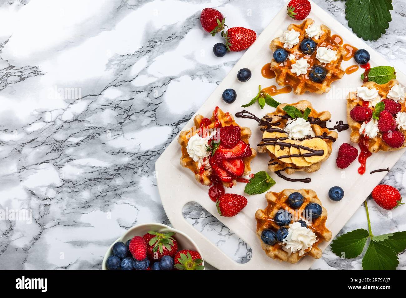 Delicious Belgian Waffles with berry, fruit, whipped cream and ...