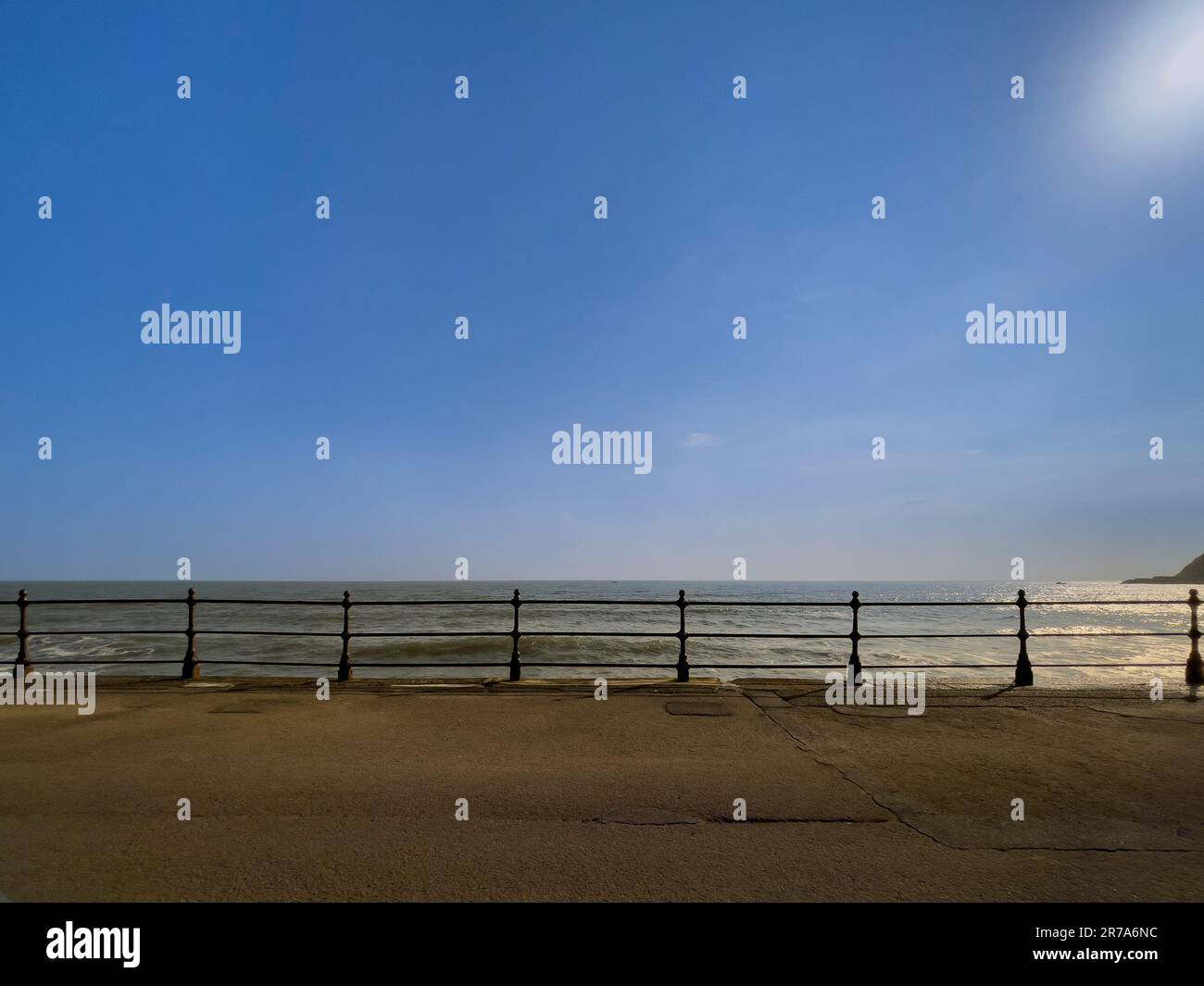 Railings along Scarborough's North Bay, Royal Albert Drive with the North Sea and a blue sky in