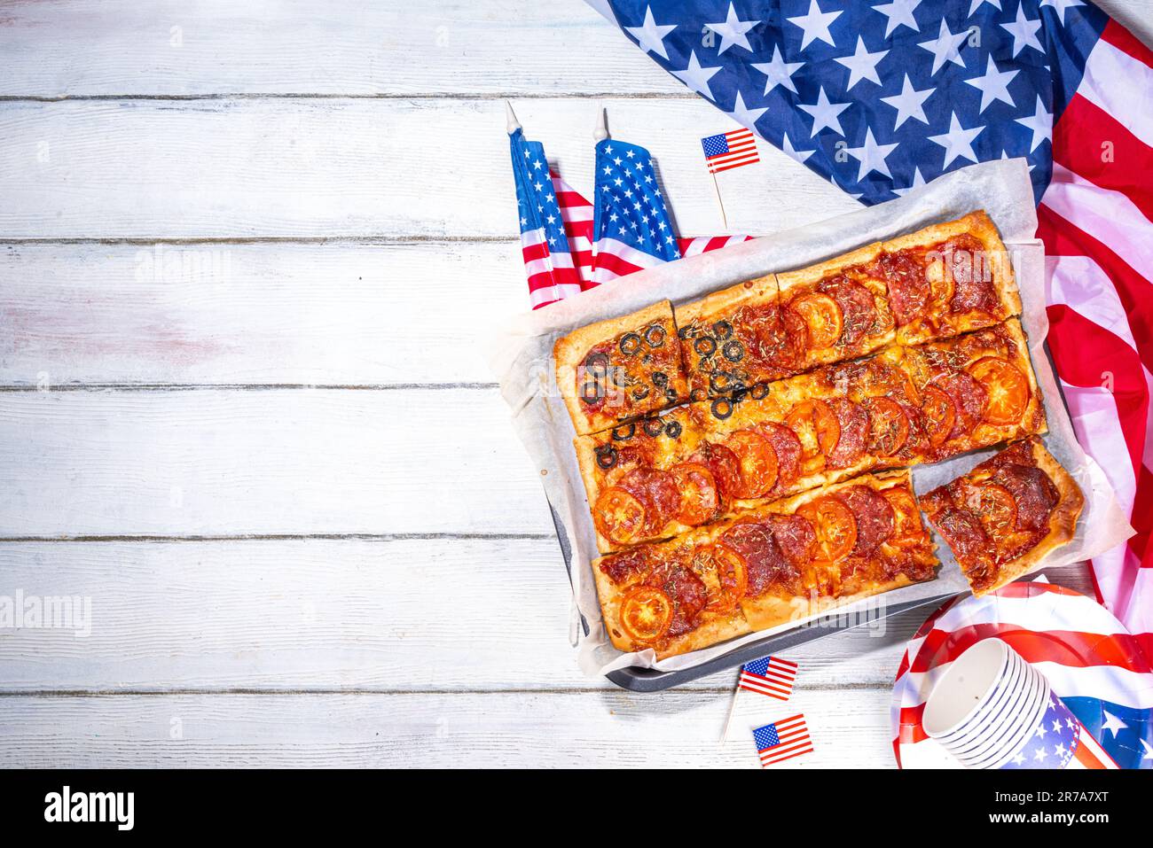 july 4th holiday party pizza, Fourth of July, Patriotic Independence day festive and picnic food. Pepperoni, tomato and black olive pizza with lot of Stock Photo