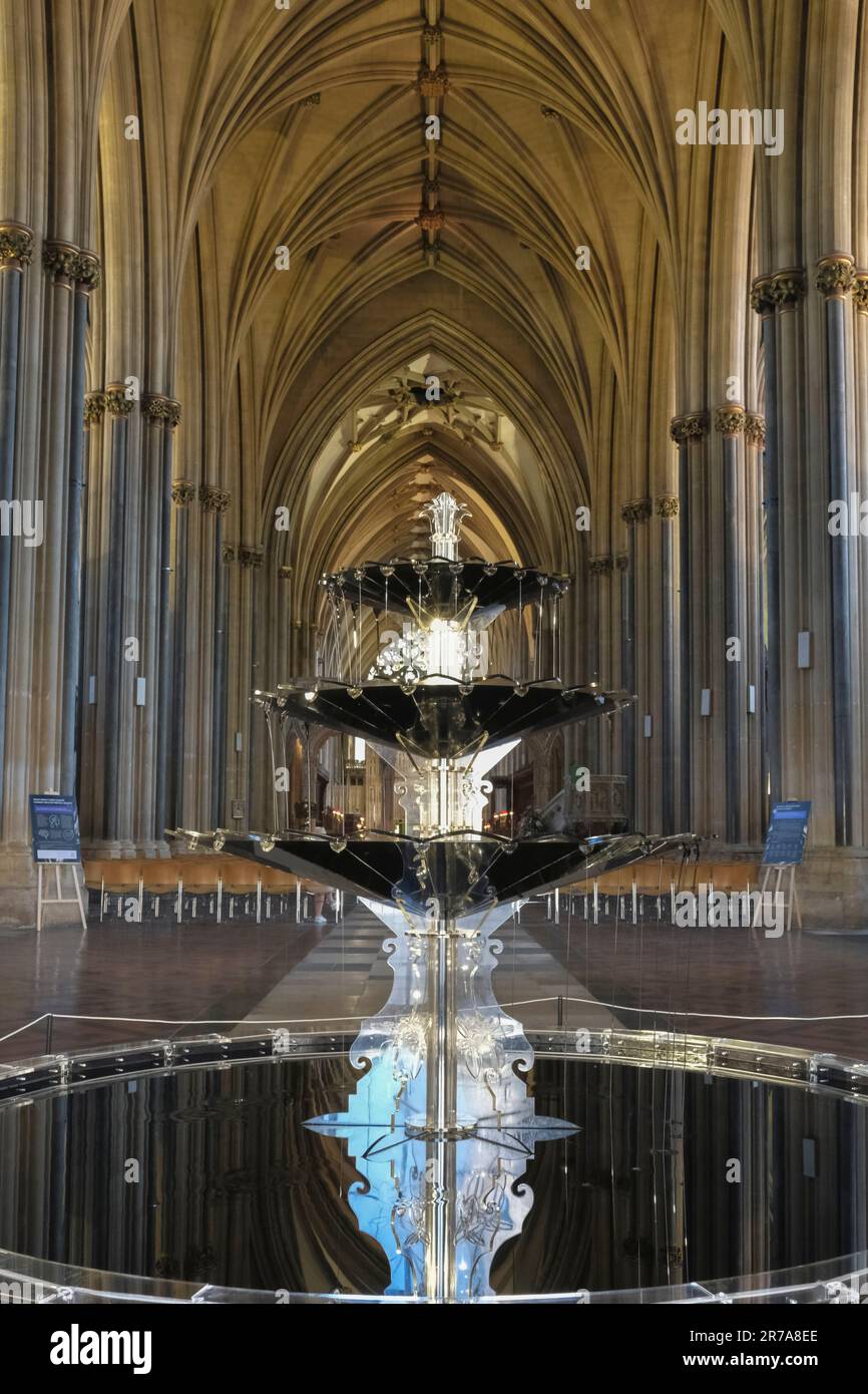 Bristol, UK. 14th June, 2023. Oil Fountain is on show in Bristol Cathedral. The fountain is housed in recycled acrylic and contains oil instead of water; reflections of the cathedral are caught on the inky black surface. Expressing concern about our reliance on oil, the artwork is intended to “stimulate discussion by creating tension between stunning visuals and the alarming subject matter it is addressing”. Credit: JMF News/Alamy Live News Stock Photo