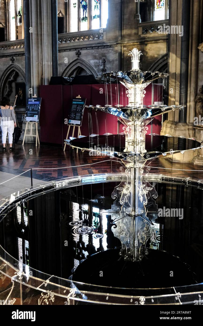 Bristol, UK. 14th June, 2023. Oil Fountain is on show in Bristol Cathedral. The fountain is housed in recycled acrylic and contains oil instead of water; reflections of the cathedral are caught on the inky black surface. Expressing concern about our reliance on oil, the artwork is intended to “stimulate discussion by creating tension between stunning visuals and the alarming subject matter it is addressing”. Credit: JMF News/Alamy Live News Stock Photo