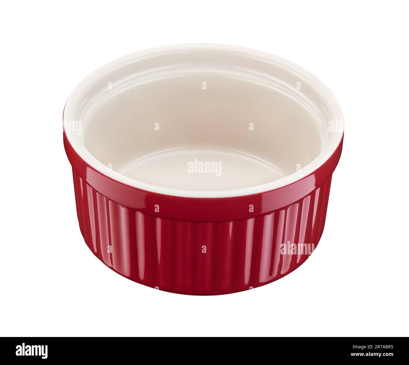 Red round empty porcelain ramekin on a white background Stock Photo