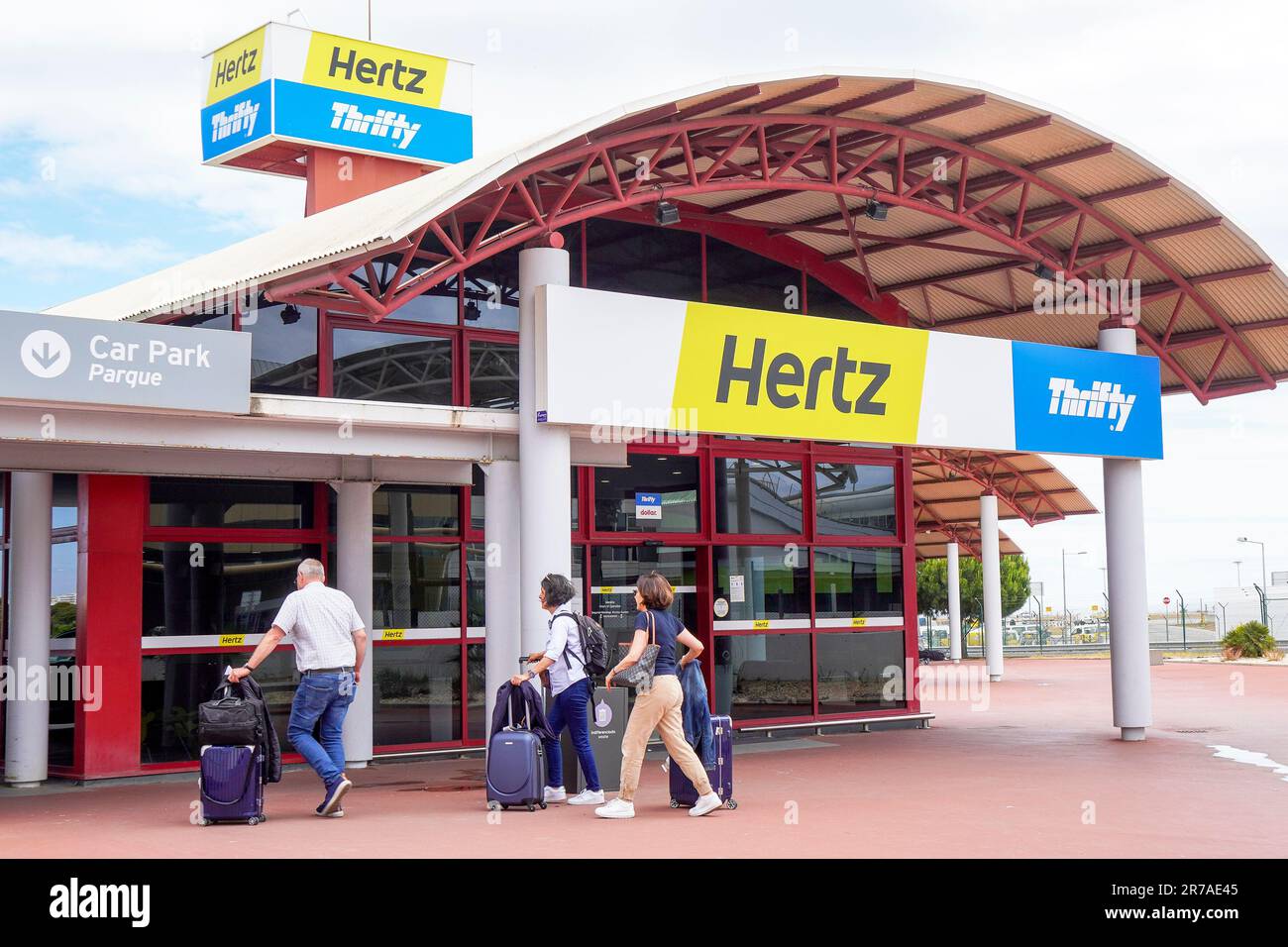 Hertz and Thrifty car hire outlet and customer desk, at Faro airport, Algarve, Portugal Stock Photo