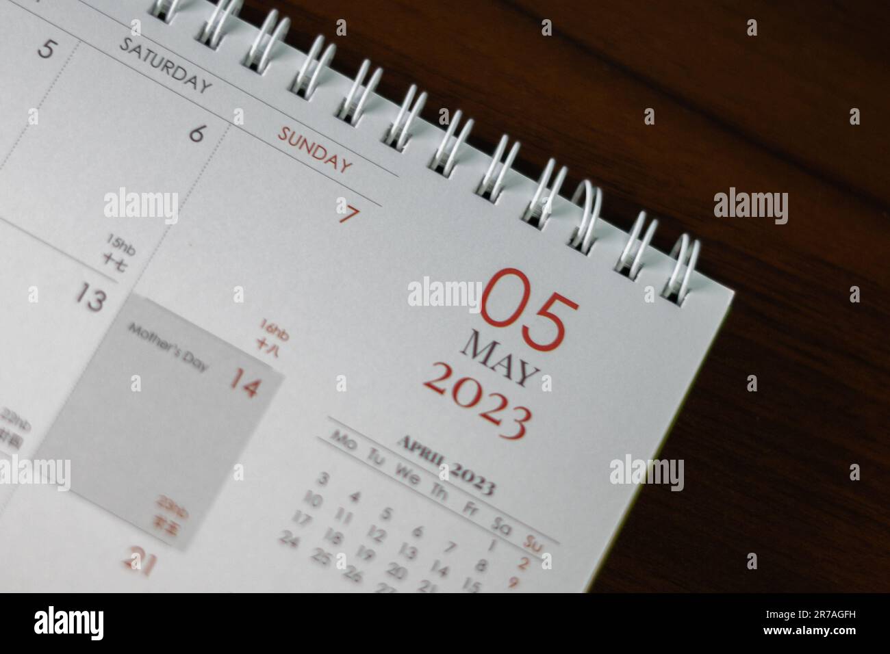 An opened calendar with a small calculator beside it Stock Photo - Alamy