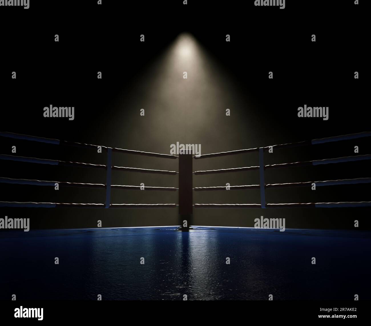 A dimly spotlit corner of a boxing ring surrounded by ropes on a dark ...