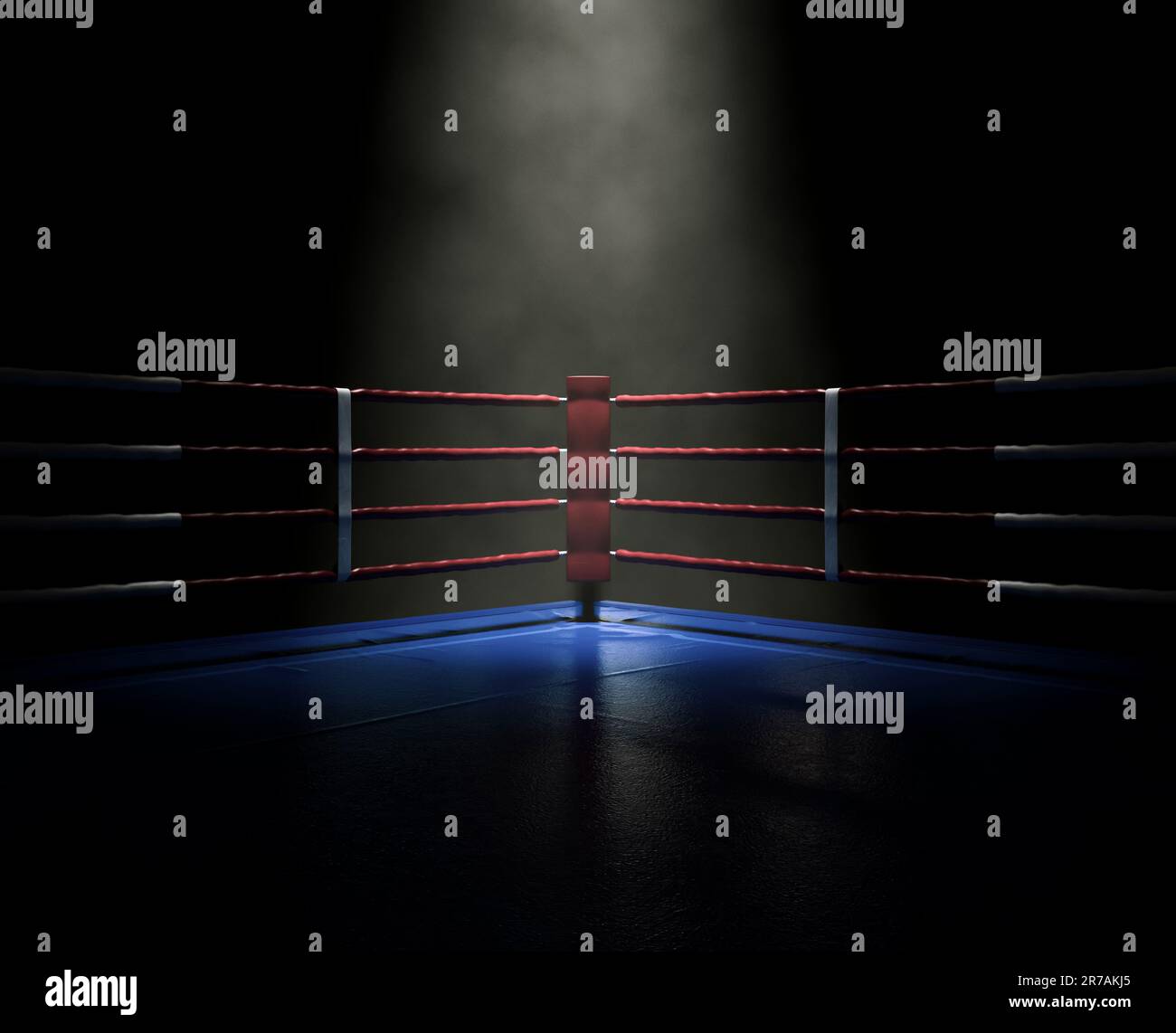 A dimly spotlit corner of a boxing ring surrounded by ropes on a dark ...