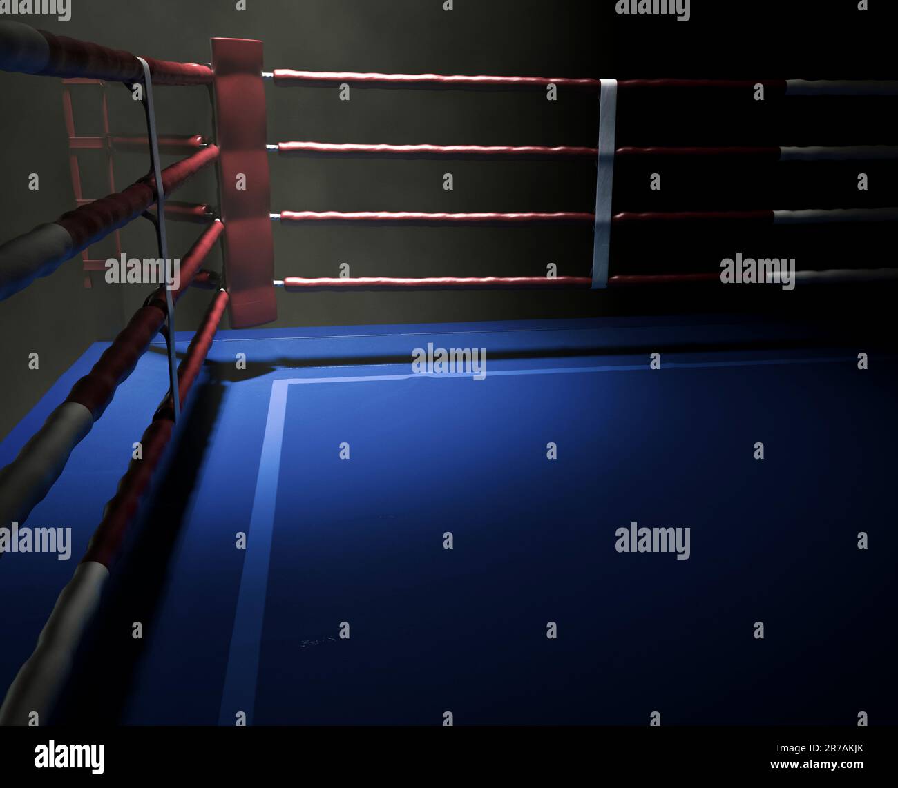 A dimly spotlit corner of a boxing ring surrounded by ropes on a dark ...