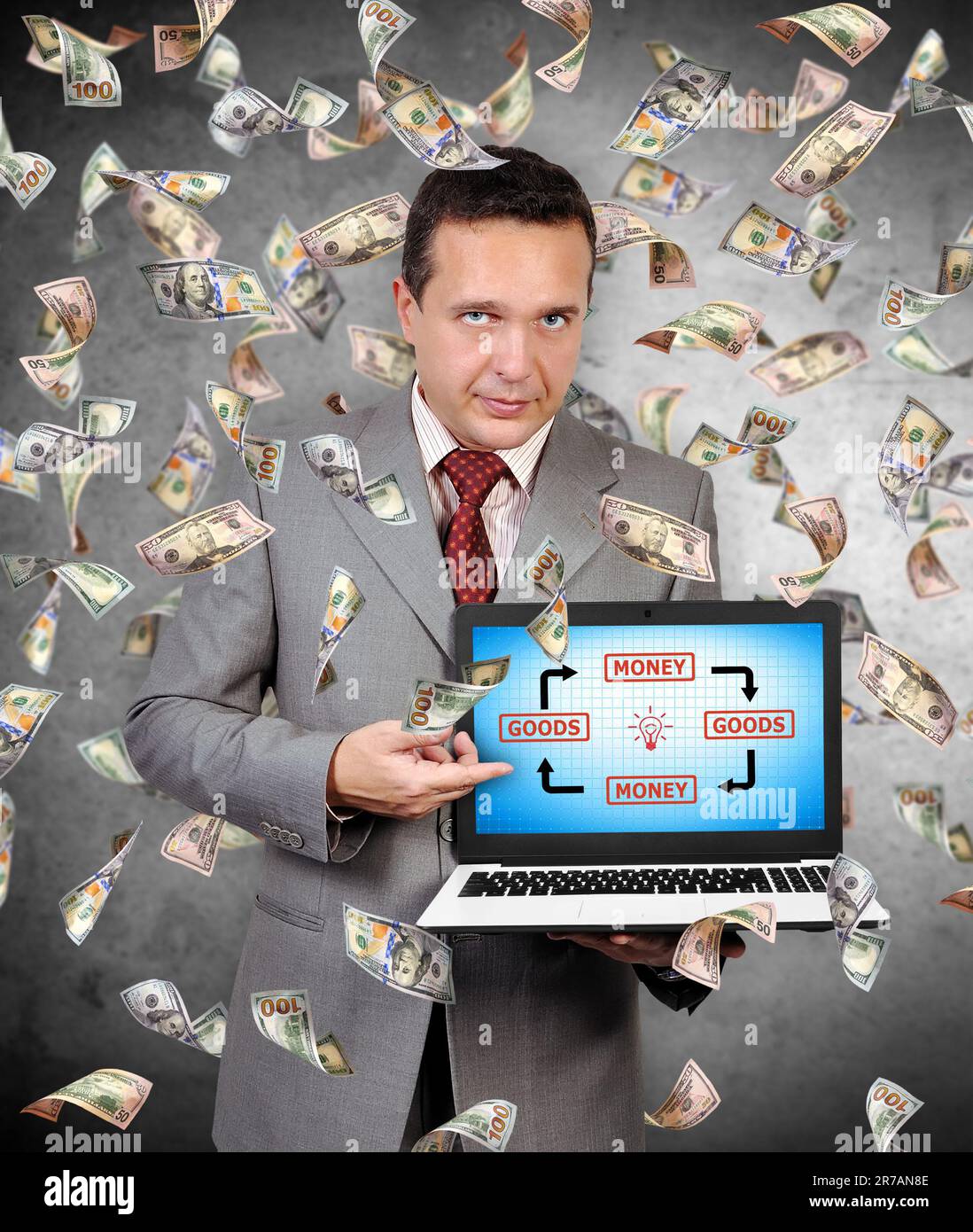 businessman points a finger at laptop monitor on which a goods and