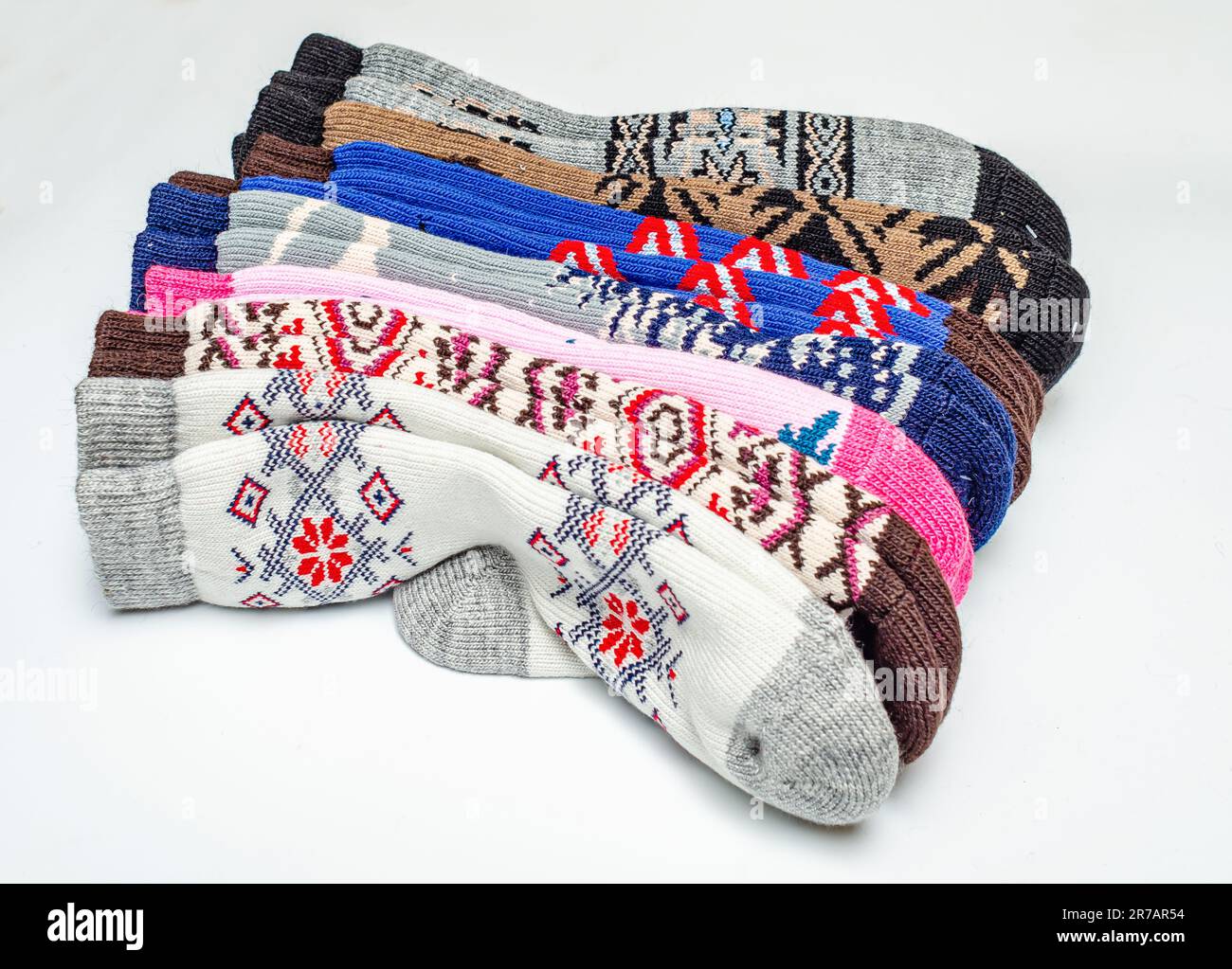 Warm wool socks folded on white background Stock Photo