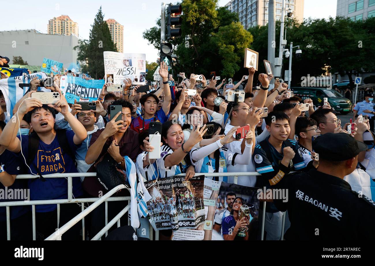 Beijing, China. 14th June, 2023. Supporters cheer as coach of Argentina team arrives ahead of a training session for an international friendly match between Argentina and Australia at Beijing Workers' Stadium in Beijing, June 14, 2023. Argentina will play against Australia here on Thursday. Credit: Wang Lili/Xinhua/Alamy Live News Stock Photo