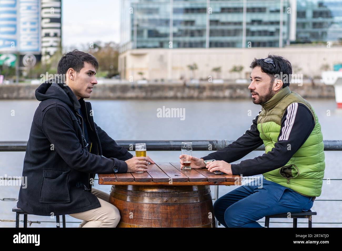 Two friends hanging out after work Stock Photo