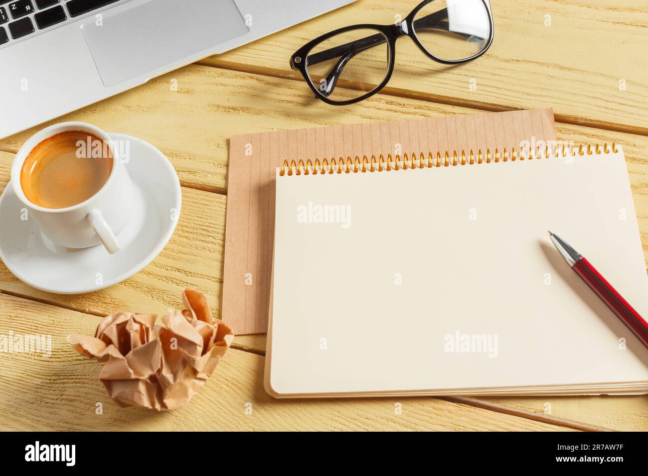 Office table background with coffee cup, pencils and computer keyboard