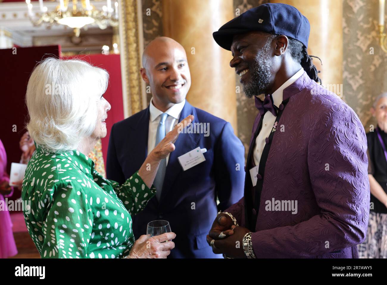 Queen Camilla speaks with Levi Roots during a reception at Buckingham ...