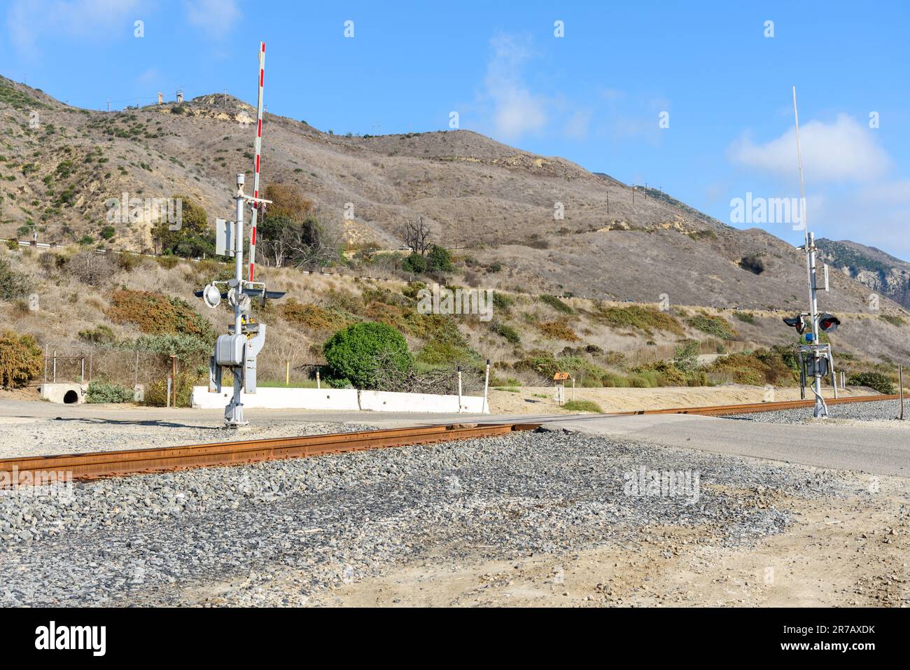 Level crossing with signals on a coastal railroad in California on a clear autumn day Stock Photo