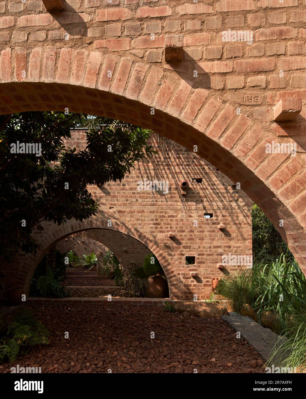 Afternoon view though arches. Subteranian Ruins, Kaggalipura, Bangalore, India. Architect: A Threshold Architects, 2023. Stock Photo