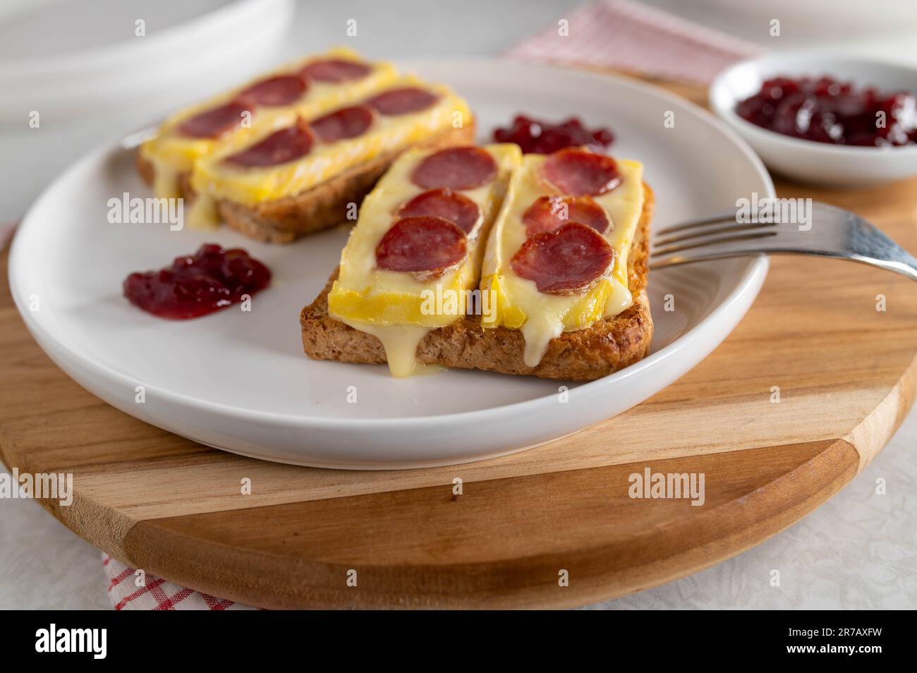 Open faced grilled cheese sandwich with brie, spanish salami. Served