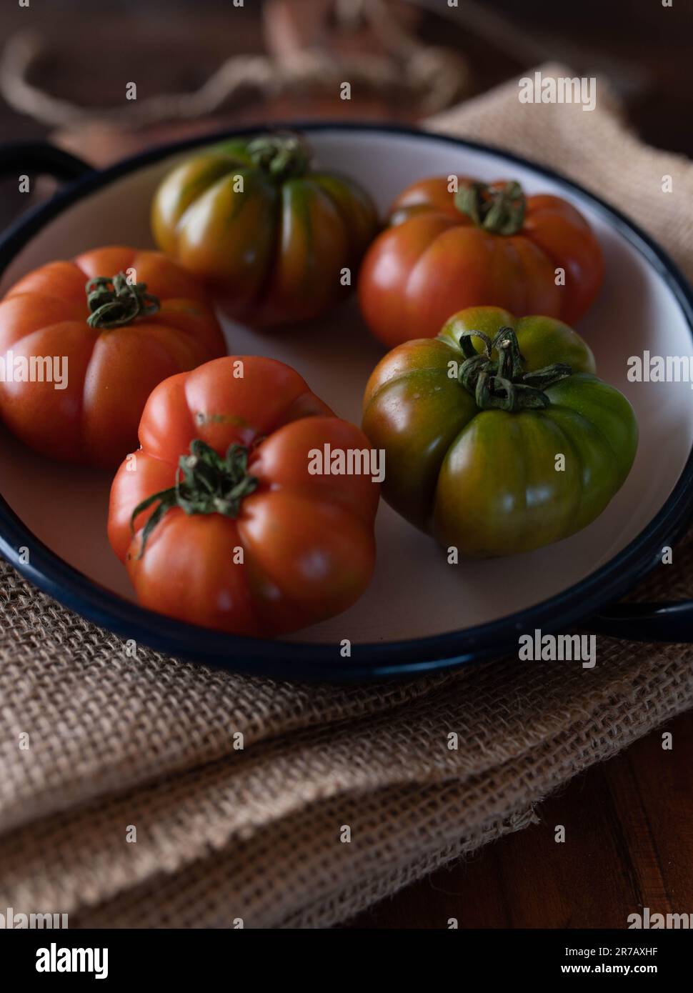 Red and green beefsteak tomatoes Stock Photo