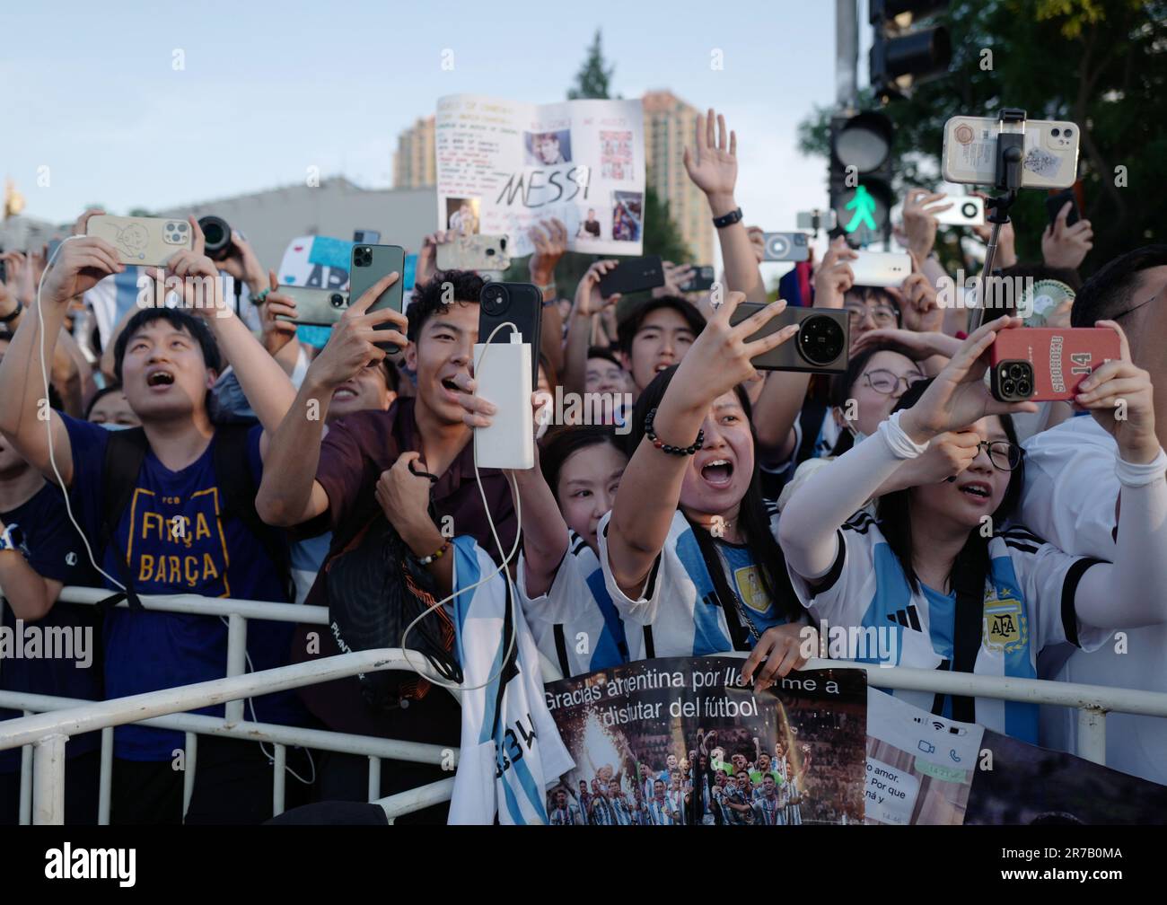 Beijing, China. 14th June, 2023. Supporters cheer as coach of Argentina team arrives ahead of a training session for an international friendly match between Argentina and Australia at Beijing Workers' Stadium in Beijing, June 14, 2023. Argentina will play against Australia here on Thursday. Credit: Zhang Chen/Xinhua/Alamy Live News Stock Photo