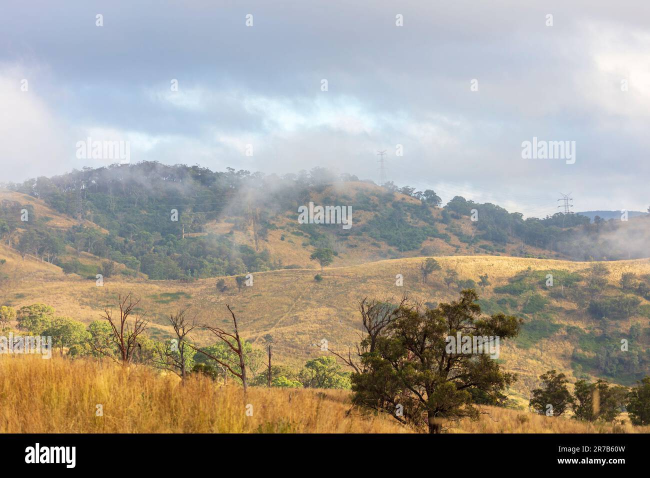 Photograph of low hanging white clouds in an agricultural valley in the ...