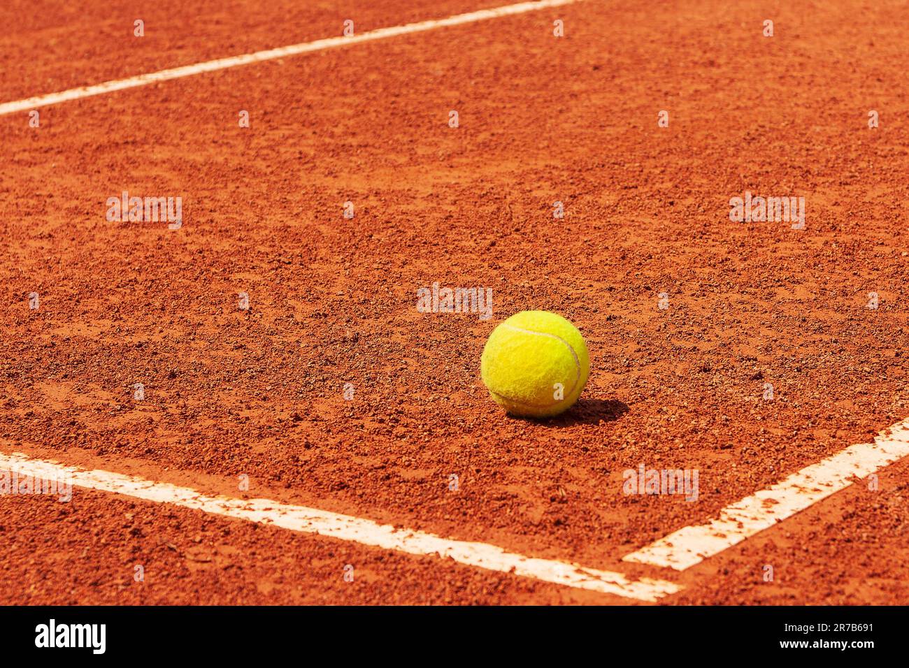 Tennis court. Tennis ball on a clay court near the line Stock Photo Alamy