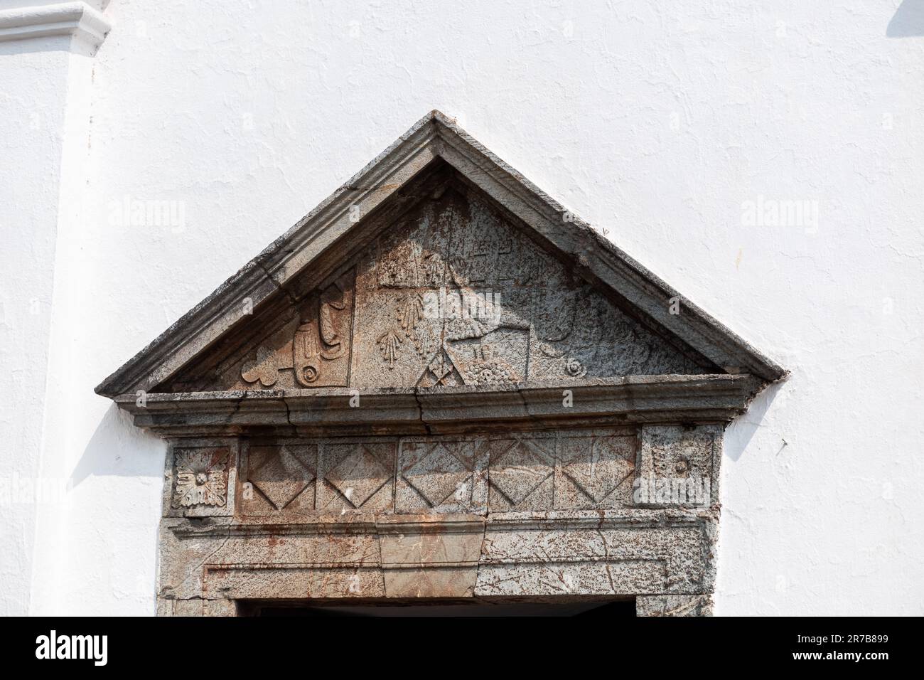 Ancient stone carvings at the entrance to the old Portuguese era St. Francis of Assisi church in Old Goa. Stock Photo